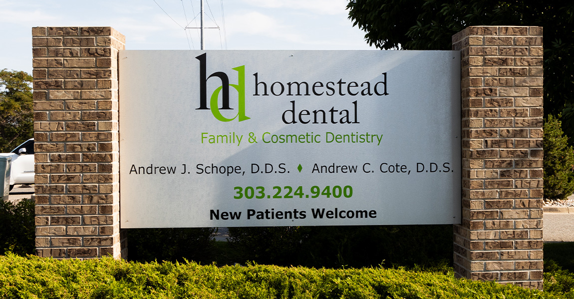 Homestead Dental sign outside of dental office