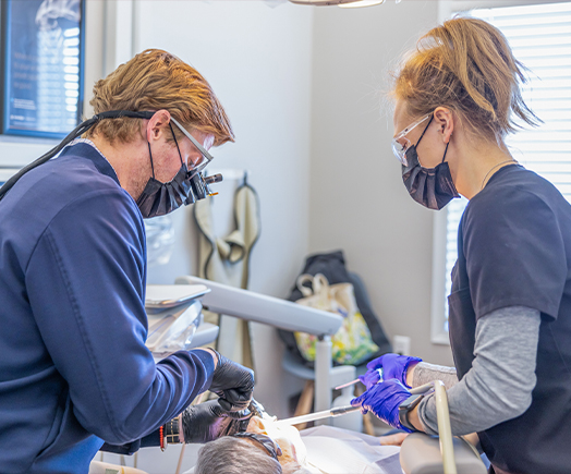 Animated dental laser removing overgrown gum tissue