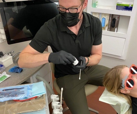 Doctor Cote treating a dental patient