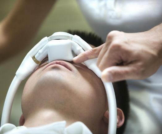 Man laying in dental chair wearing mask for nitrous oxide sedation dentistry