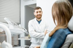 a patient chatting with their dentist