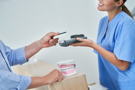 a patient paying their dental bill